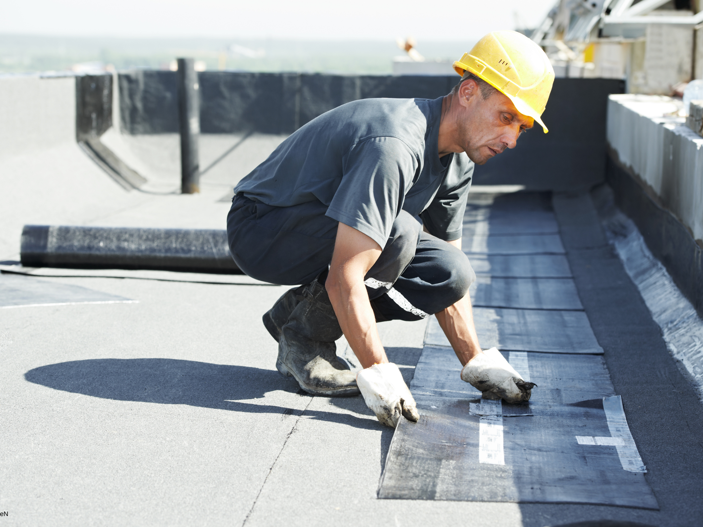 Flat roof coating application