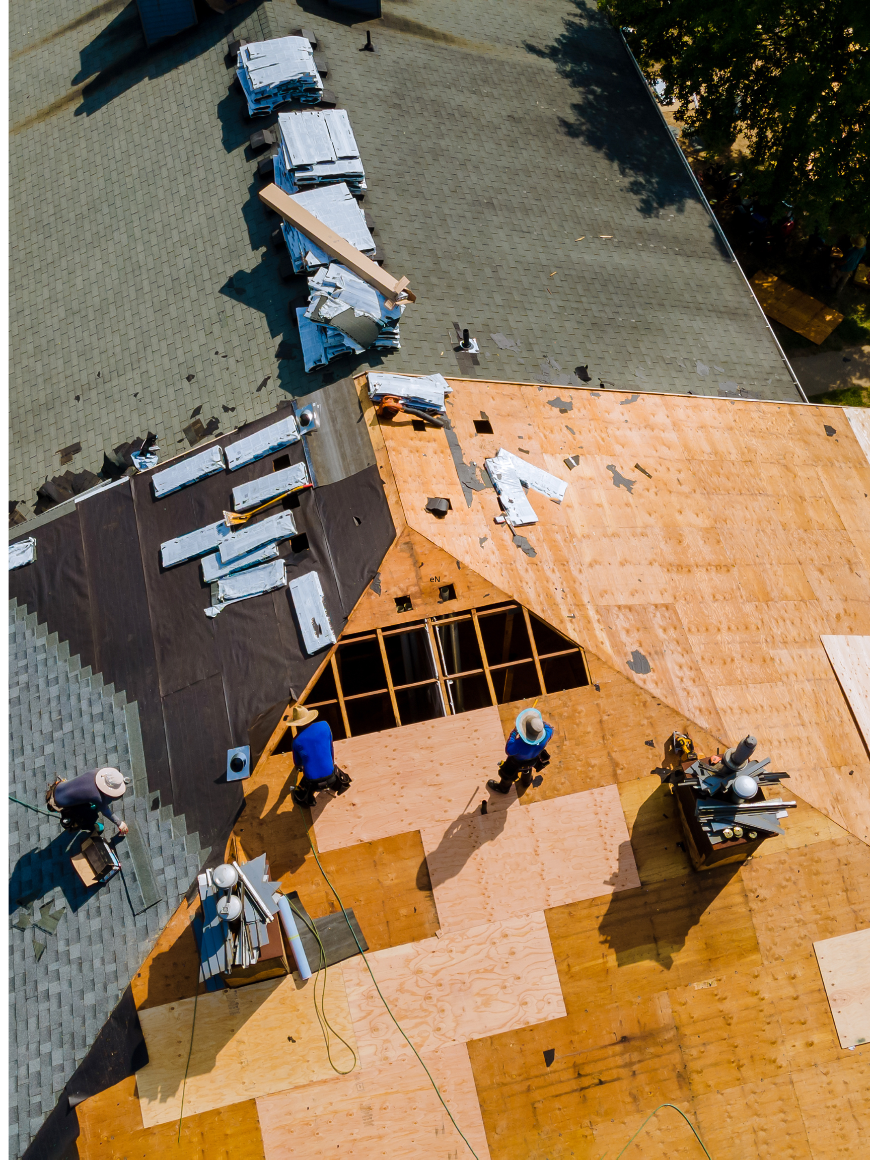 Engineer Roofing crew working on roof